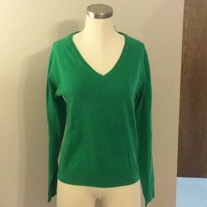 Green V-neck sweater